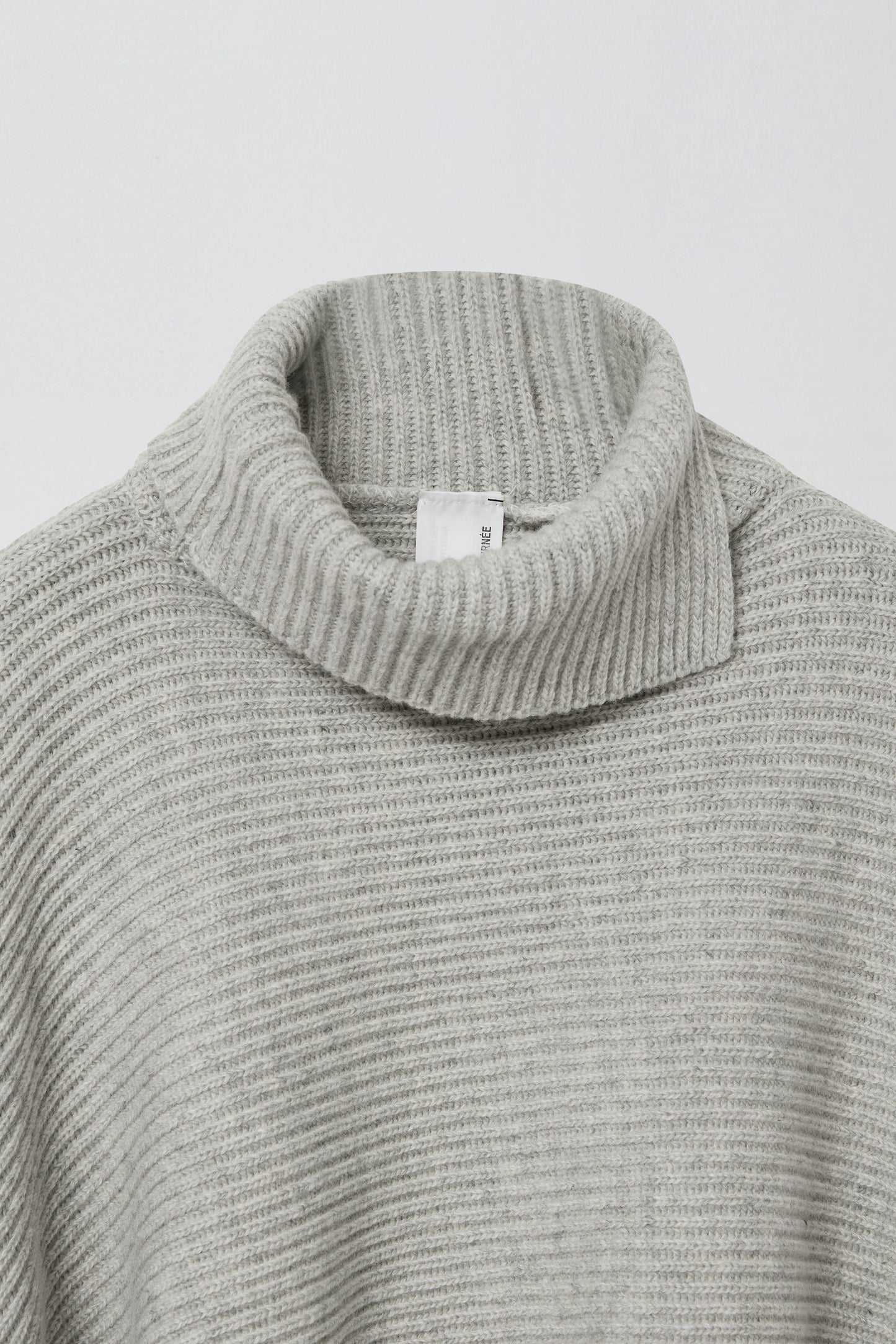 SLIT WOOL KNIT CAPE MELANGE